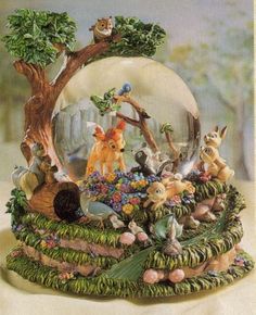 a snow globe with many animals around it