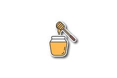 a jar of honey with a wooden spoon