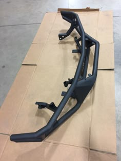 the front bumper frame is shown on top of cardboard