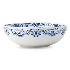 a blue and white bowl sitting on top of a table