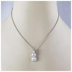 This sparkling pendant necklace features one pear shaped diamond, one emerald cut diamond and 11 round brilliant cut diamonds set in classic 18K white gold.  Total diamond weight: 1.18 ct.  Diamond color:  G-H  Diamond clarity:  VS1-VS2  Stamped: 750  Size:  16.75 inches (necklace)  22 mm x 9 mm (pendant)  Weight: 5.8 gr./ 3.7 dwt.  JAGi Certificate included  Very good condition, professionally polished.  Will come packaged in a gift box or pouch (when possible) and will be shipped U.S. Priority Mail Insured. White Gold Cubic Zirconia Pear-shaped Drop Necklace, Pear-shaped White Gold Drop Necklace With Cubic Zirconia, White Cubic Zirconia Teardrop Pendant Diamond Necklace, White Cubic Zirconia Teardrop Pendant Necklace, White Teardrop Cubic Zirconia Diamond Necklace, Pink Pendant Necklace, Purple Pendant Necklace, Art Deco Pendant Necklace, Black Pendant Necklace