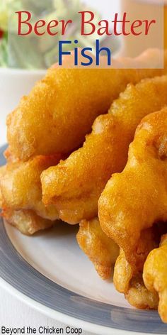 some fried food on a plate with the words beer batter fish in front of it