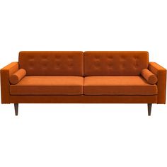 an orange couch sitting on top of a white floor