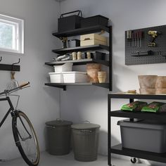 a bicycle parked next to a shelf filled with containers