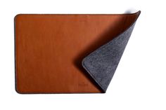 a brown and grey leather case with a gray felt corner on the bottom half of it