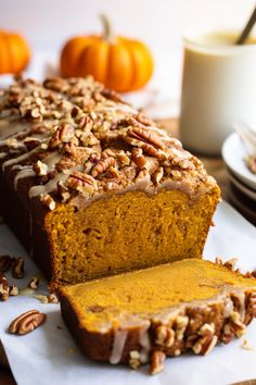 a loaf of pumpkin bread with pecans on top