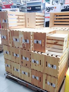 several wooden crates stacked on top of each other in a store with price tags attached to them