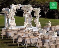 an outdoor wedding set up with chairs and flowers