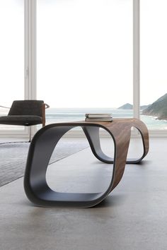 the modern furniture is designed to look like an abstract piece of wood and metal, while it