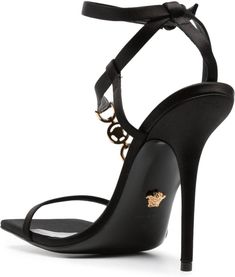 Step into luxury with these stunning sandals from Versace. The satin finish and Medusa plaque detail add an elegant touch to any outfit, while the high stiletto heel exudes confidence and style. With a buckle-fastening ankle strap and branded leather insole, these sandals are both fashionable and comfortable for all-day wear. 115mm high stiletto heel Satin finish and calf leather material Medusa plaque detail for added elegance Buckle-fastening ankle strap for a secure fit Branded leather insole Luxury Satin Sandals, Luxury Satin Evening Sandals, Evening Satin Sandals With Pointed Toe, Satin Sandals For Evening With Pointed Toe, Elegant Satin Sandals With Open Heel, Luxury Satin Heels With Heel Strap, Evening Satin Sandals With Heel Strap, Luxury Satin Party Sandals, Luxury Satin Sandals For Party