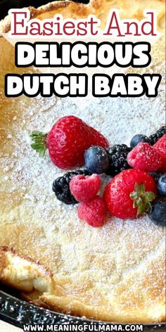 a close up of a pie with berries on it and the words, easy and delicious dutch baby