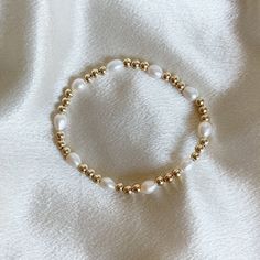 White Pearl Bracelet - Stretchy Bracelet With Pearl - Gold Filled Bead Bracelet - Yellow Gold Filled Pearl Bracelet - Pearl Gold. Bracelet  This bracelet is hand strung in Southern California with real high quality freshwater pearls and 14k gold filled 4mm beads.  We use a very durable stretchy band that is secured very well. This bracelet is stretchy, but comes in many sizes. Gold Bead Bracelets Diy, Classy Beaded Bracelets, White And Gold Beaded Bracelet, Pearl Bead Bracelet Ideas, Stretchy Bracelets Diy, Pearl Gold Bracelet, White Pearl Bracelet, Bracelet Pearl