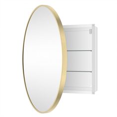 an oval mirror mounted on the wall next to a white cabinet with gold trimmings