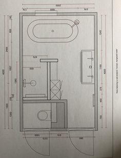 a drawing of a bathroom with a toilet, sink and bathtub in the floor plan