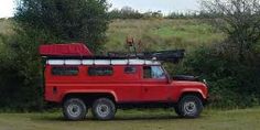 a red truck parked on the side of a road