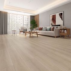 an empty living room with wood flooring and large windows in the backround