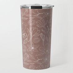 a brown and white floral pattern is shown on the side of a stainless steel tumbler