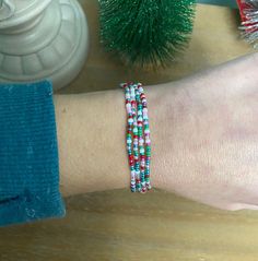 Each with its own cheerful mix of colors, these bracelets add a festive touch to any outfit.  Approx. 19.25" this beautiful array of beads can be wrapped twice around the ankle, 3 times around the wrist or simply slip over your head & wear as a necklace.  One size fits most. Stack with additional anklets/bracelets/necklaces to achieve different looks.  Made with a variety of 11/0 & 8/0 Czech glass seed beads.  Made to order. Pattern will vary but will include all colors in photo.  Add more bracelets to your stack here: etsy.com/listing/1038223316/ Add a set of matching stacking rings here: etsy.com/listing/829181666/ Wear with care:    Bracelets are made with stretchy cord but please use care when handling. Stretching too far may cause breakage. Avoid the 5 S's to keep your jewelry in qual Single Necklace, Sleep Spray, Triple Wrap Bracelet, Head Wear, South Bend, Jewelry Christmas, Holiday Jewelry, Anklet Bracelet, Glass Seed Beads