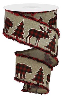 a roll of red and black plaid ribbon with moose, trees and snowflakes on it