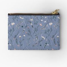 a small blue pouch with flowers on it