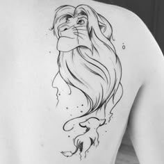 a woman's back with a drawing of a lion on it