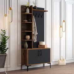 a wooden cabinet sitting on top of a hard wood floor next to a potted plant