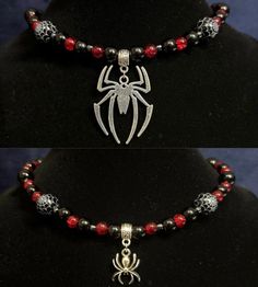 two pictures of spiderman necklaces with red beads and silver accents on display in front of a black mannequin