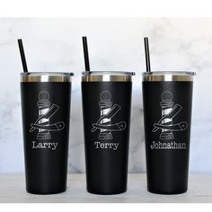 three personalized tumblers with straws on them