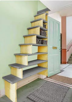 the stairs are made out of plywood and have baskets on each side for storage