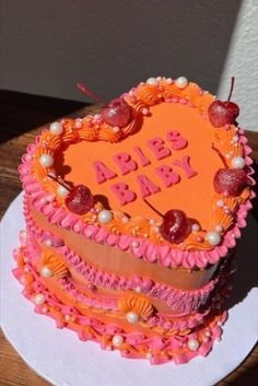 a heart shaped cake with the words baby on it