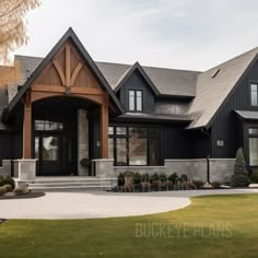 a large black house with lots of windows