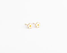 14k Solid Daisy Studs (Ready to ship within 1 - 2 days) These daisy stud earrings are made of solid gold, they are smooth all the way around and sturdy. Earring Details: - Perfect for all ages -6mm -14k solid gold -Tarnish Free Dainty 14k Gold White Earrings, Handmade White 14k Gold Earrings, 14k Gold White Hypoallergenic Earrings, White 14k Gold Flower-shaped Earrings, Nickel-free 14k Gold White Earrings, White 14k Gold Nickel-free Earrings, Nickel-free White 14k Gold Earrings, Baby Earrings Gold, Newborn Earrings