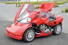 a red sports car with its hood open