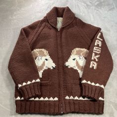 a brown sweater with an eagle on it