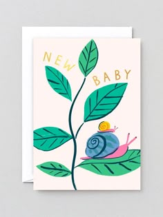 a card with a snail on top of a green leaf and the words new baby