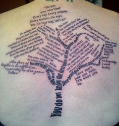 the back of a person's neck with words written on it