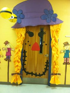 a door decorated to look like a scarecrow