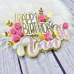 a happy birthday card with pink roses and the words tiara on it, surrounded by feathers