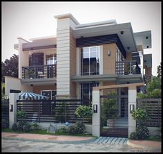 a two story house with an attached balcony and balconies on the second floor