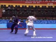 two men in white fencing suits on a court