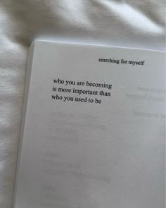 an open book with the words searching for myself who you are becoming is more important than who you used to be