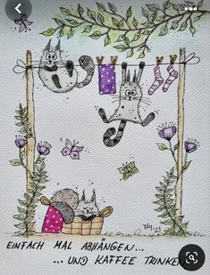 an image of two cats hanging out on clothes line with the caption, enfah mai abangel un kaffe tonki