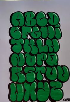 the letters are green in color and have different shapes, sizes, and font options