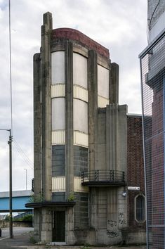 an old building with graffiti on the side