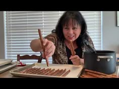 a woman is making some food in the kitchen and it looks like she's cooking