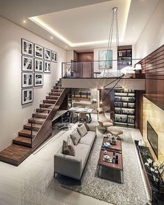 a living room filled with furniture next to a staircase