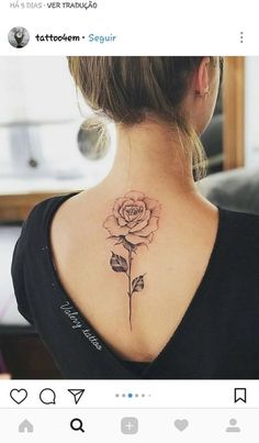 a woman with a rose tattoo on her back