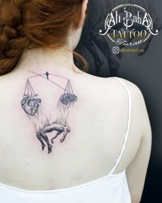 a woman with a tattoo on her back