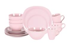 a pink dinner set with cups and saucers on the side, in front of a white background