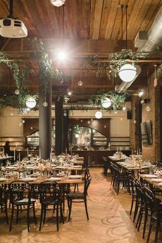 the inside of a restaurant with tables and chairs set up for an elegant dinner party